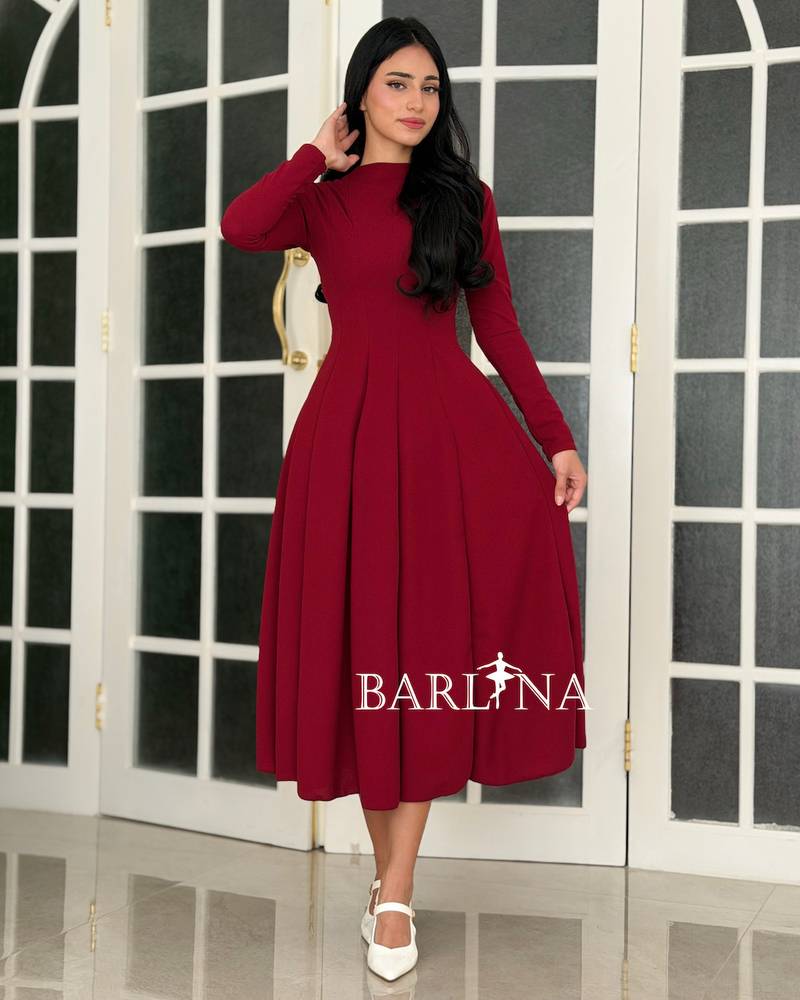 A soft red dress with a sophisticated classic design