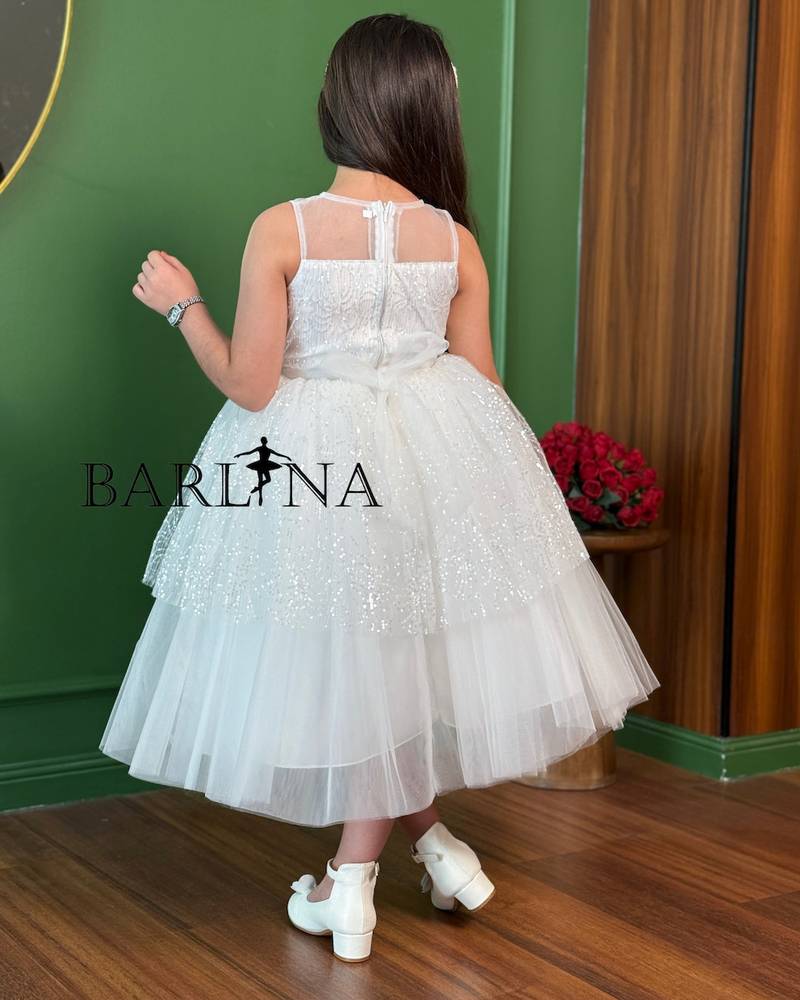 White girls' dress with tulle layers and a touch of sparkle
