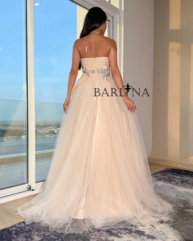 Light beige dress with intricate floral embroidery