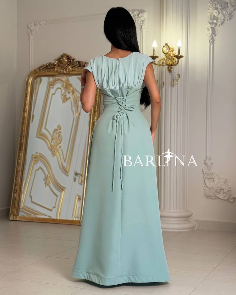 Occasion dress with a fitted waist and scattered crystals