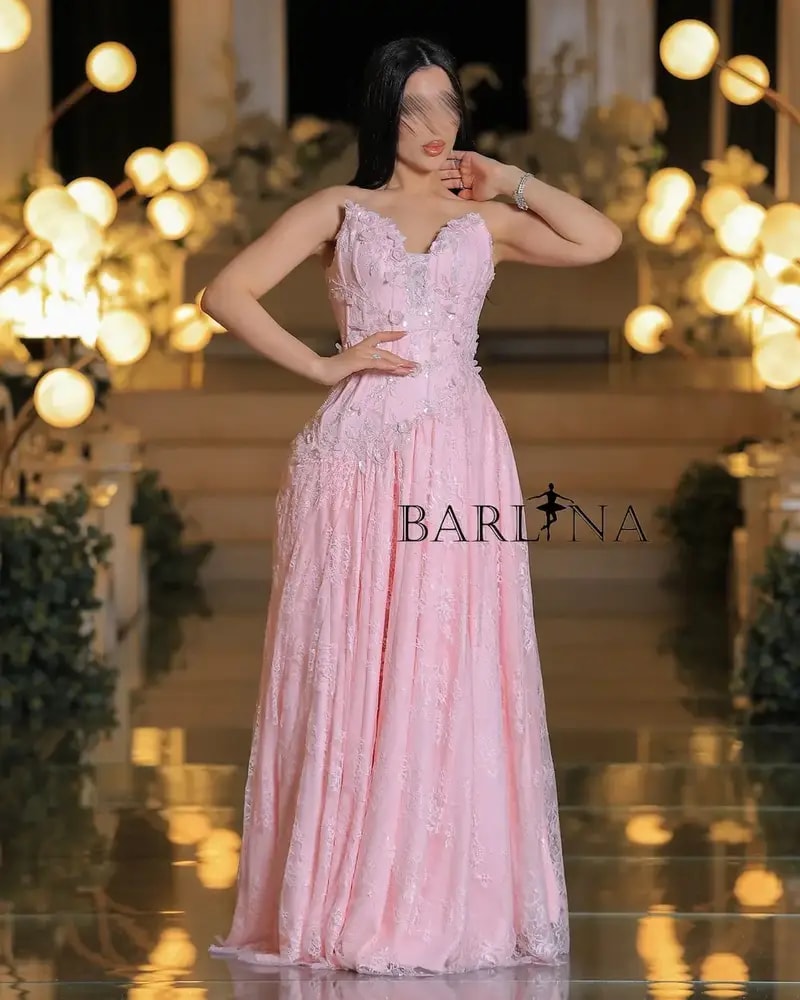 Pink evening dress embroidered with delicate lace