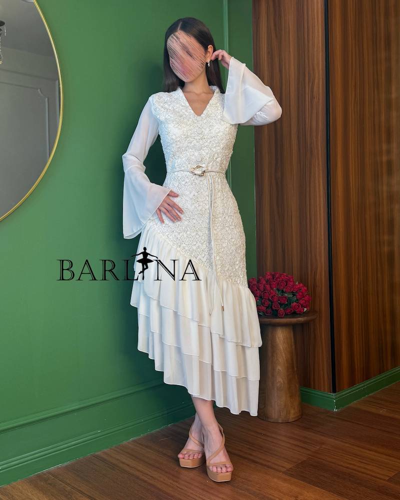 Soft white mid-length embroidered dress