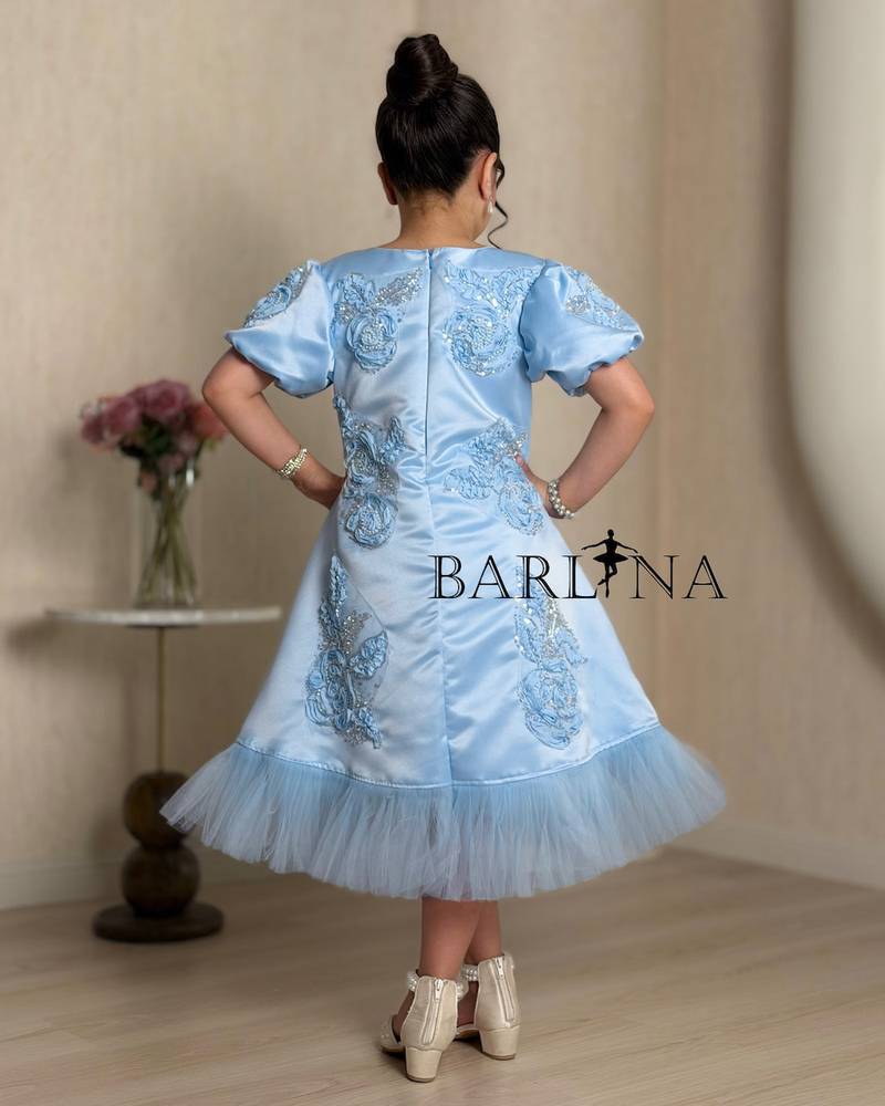 Luxurious blue girls dress with shimmering details