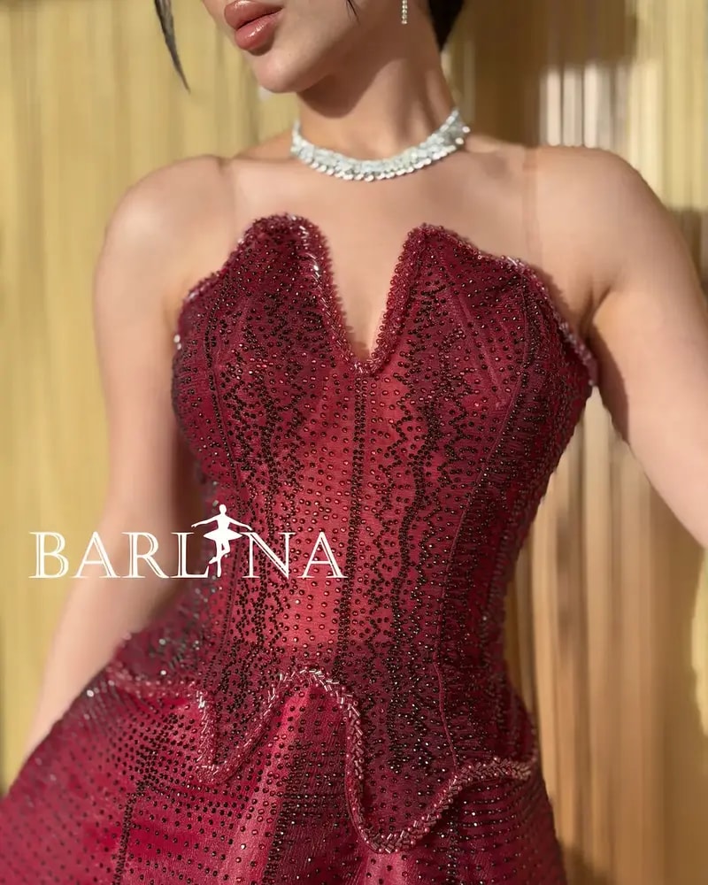 Burgundy puffy evening dress with a corset design