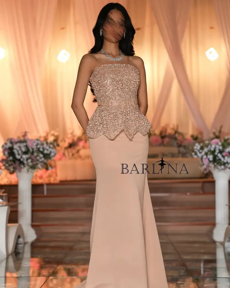 Beige evening dress with an embroidered corset design