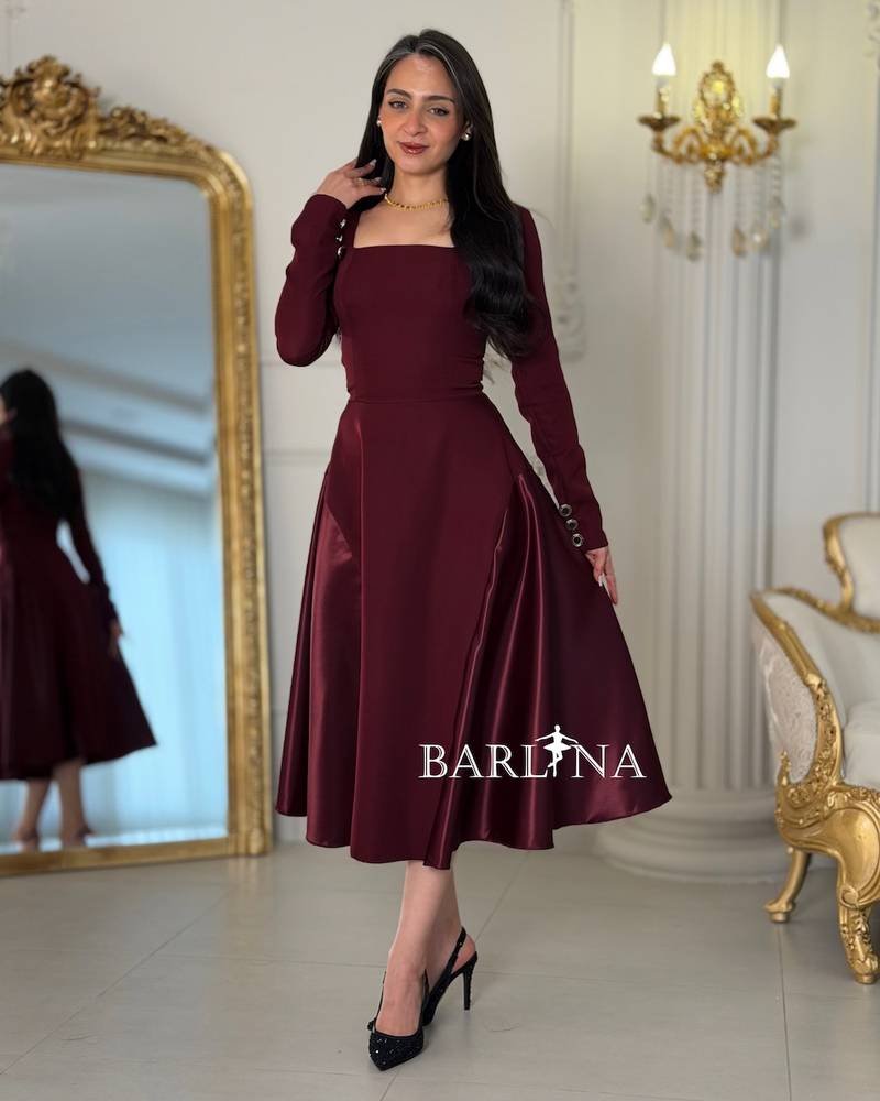 A burgundy midi dress with an elegant