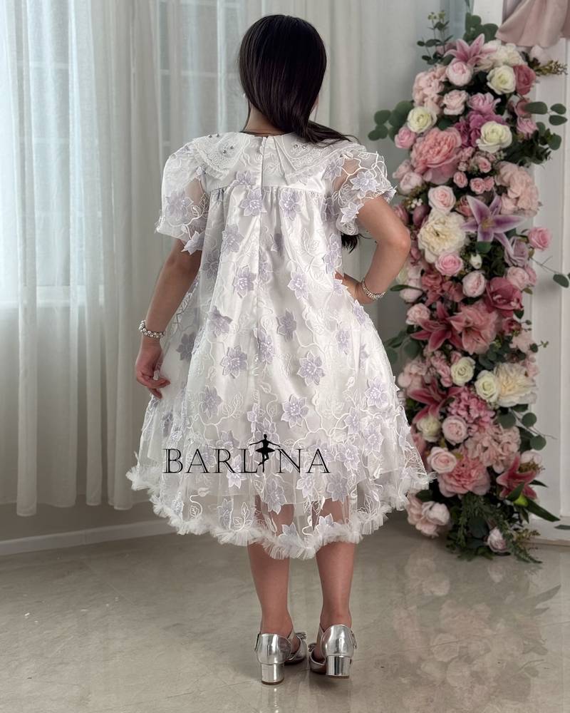 White girl's dress embroidered with purple flowers