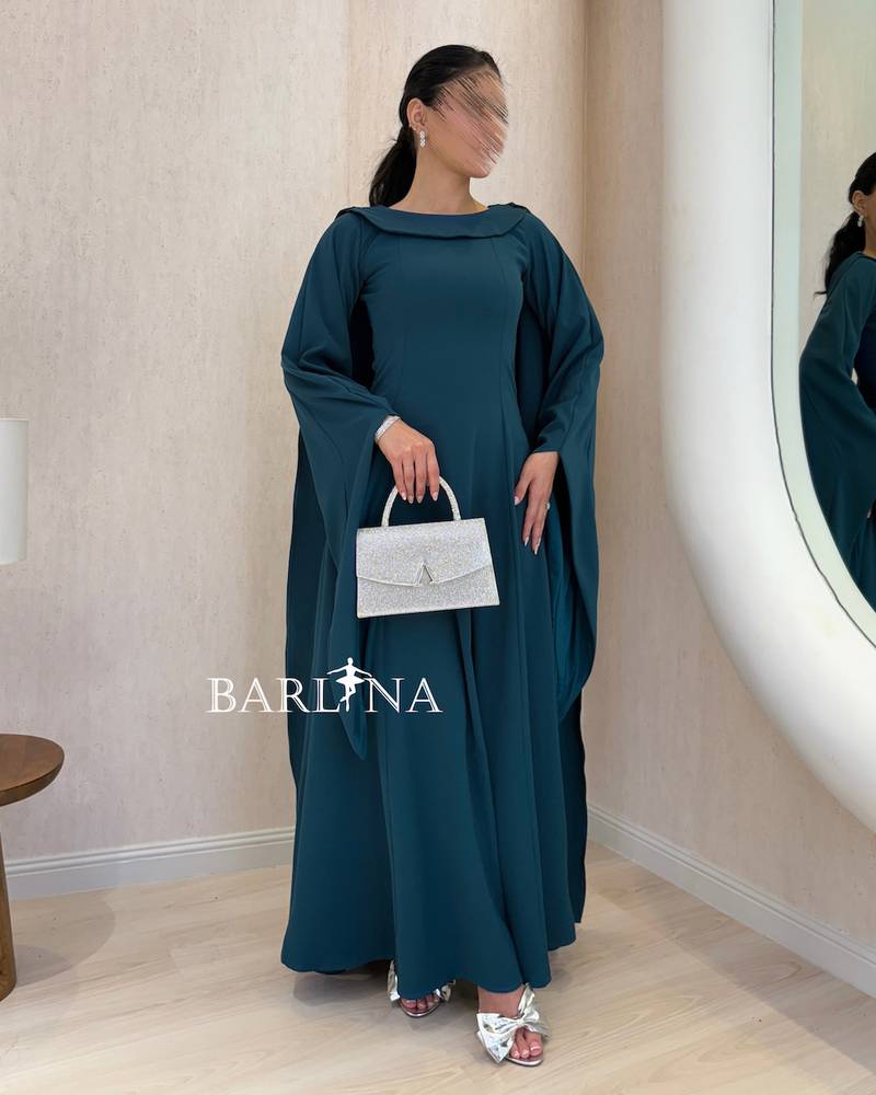 Petrol blue dress with a wide design and loose sleeves