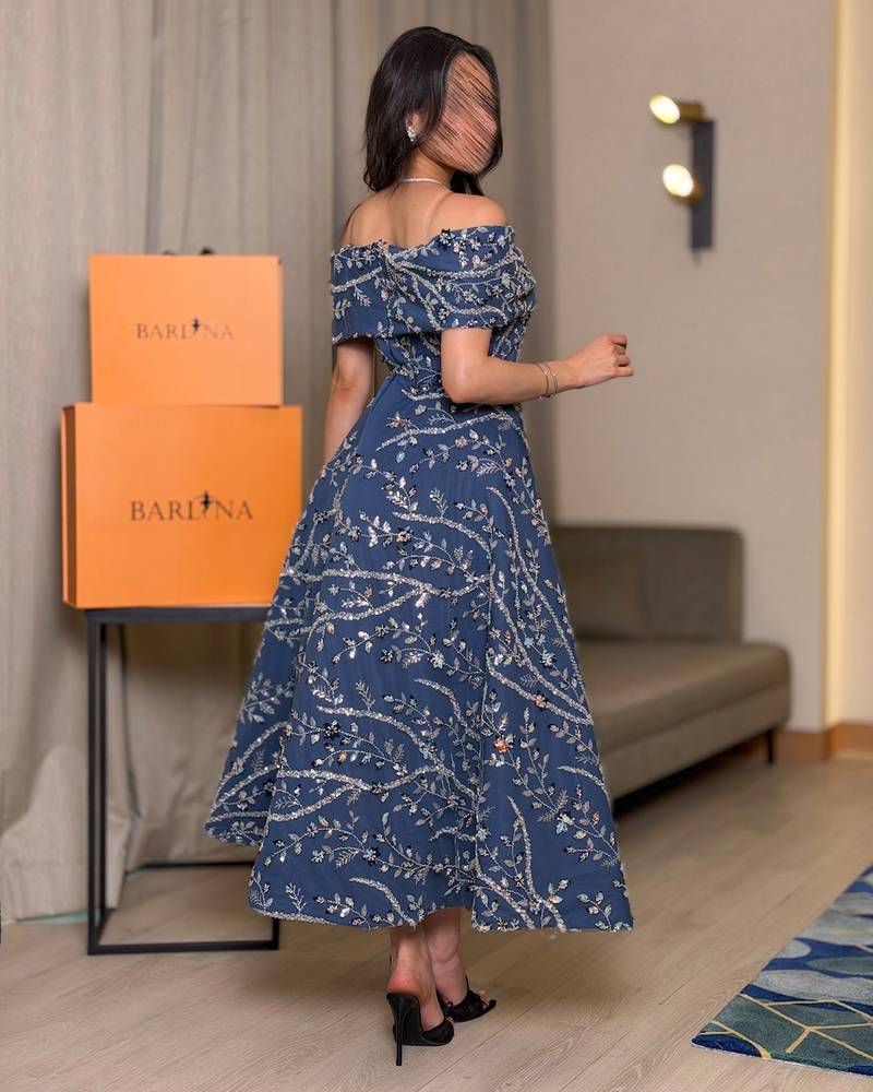 Midi dress embroidered with shimmering botanical patterns