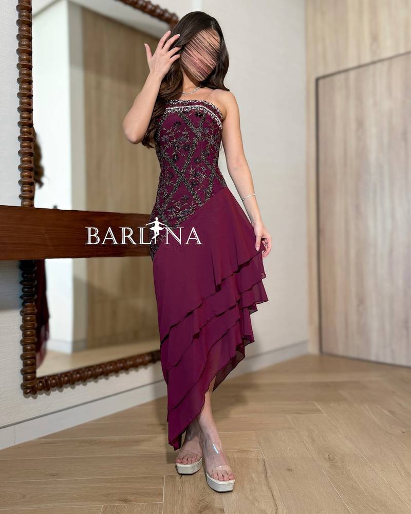 Burgundy dress with soft layers and an asymmetrical hem