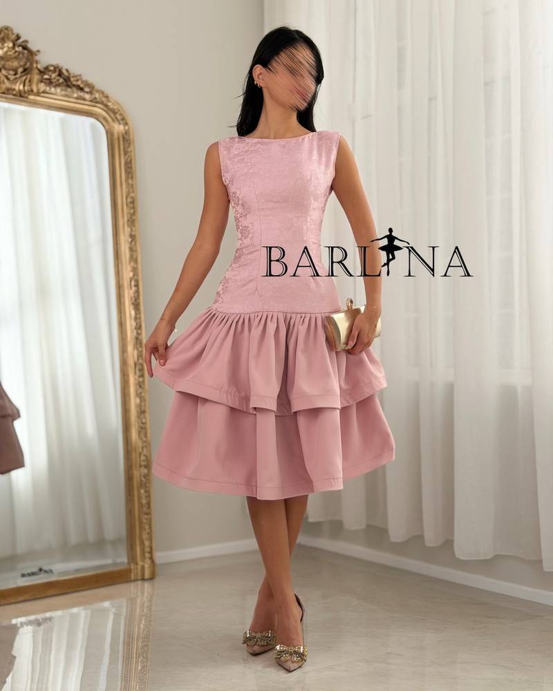 A soft dress with a low waist and layers of ruffles