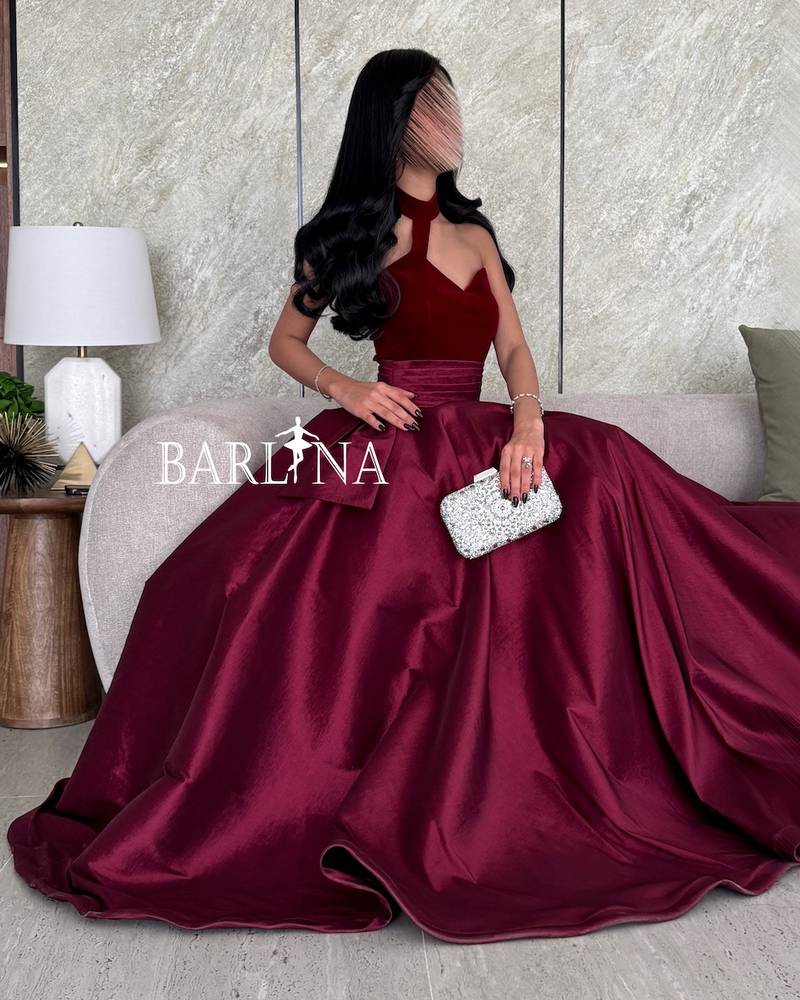 Luxury burgundy dress with a distinctive neckline