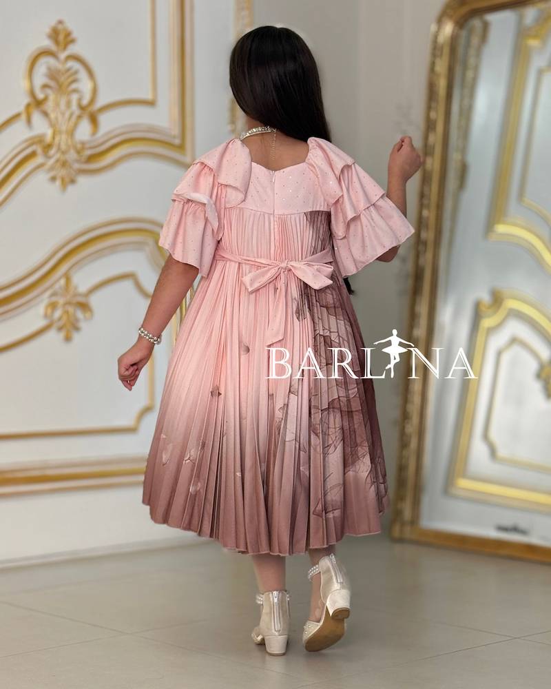 A soft girl's dress decorated with delicate prints