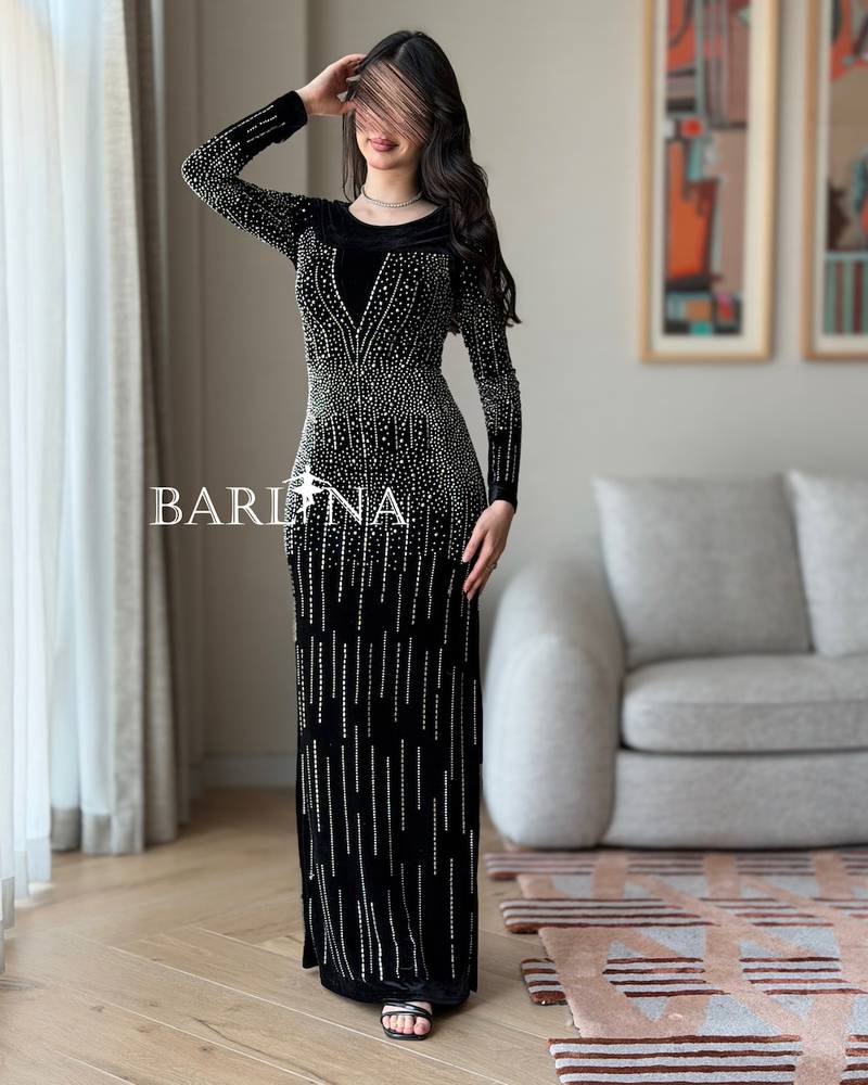 Black velvet dress embroidered with matching crystals