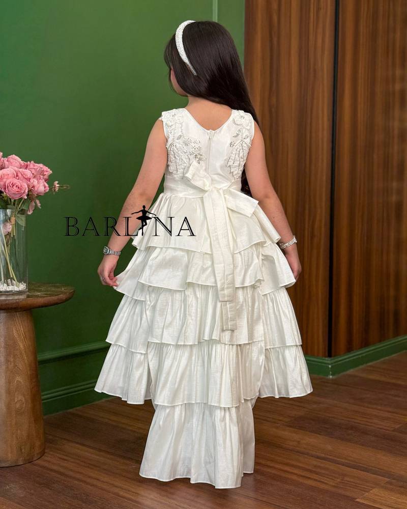 White girls' dress with ruffled layers and delicate embroidery