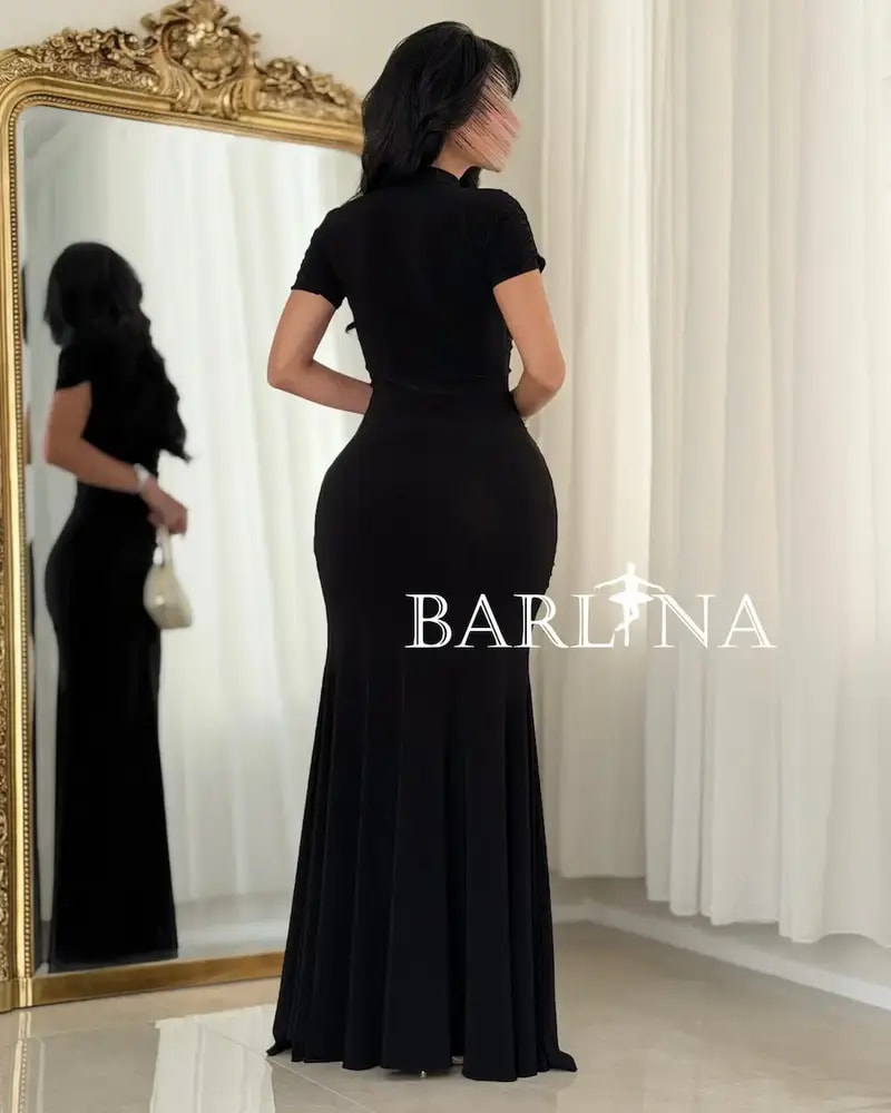 A black dress with delicate details and a classic touch