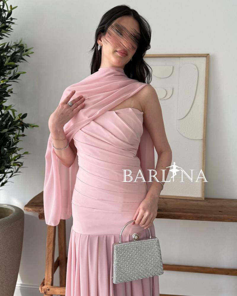 A soft pink dress with a matching shawl