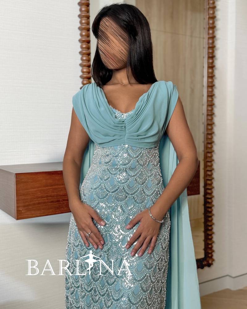 Ice blue dress with wave-shaped embroidery