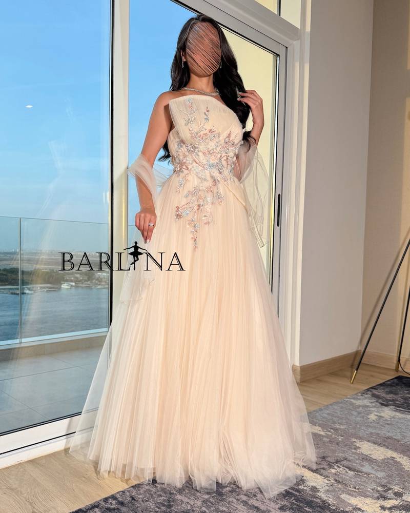 Light beige dress with intricate floral embroidery