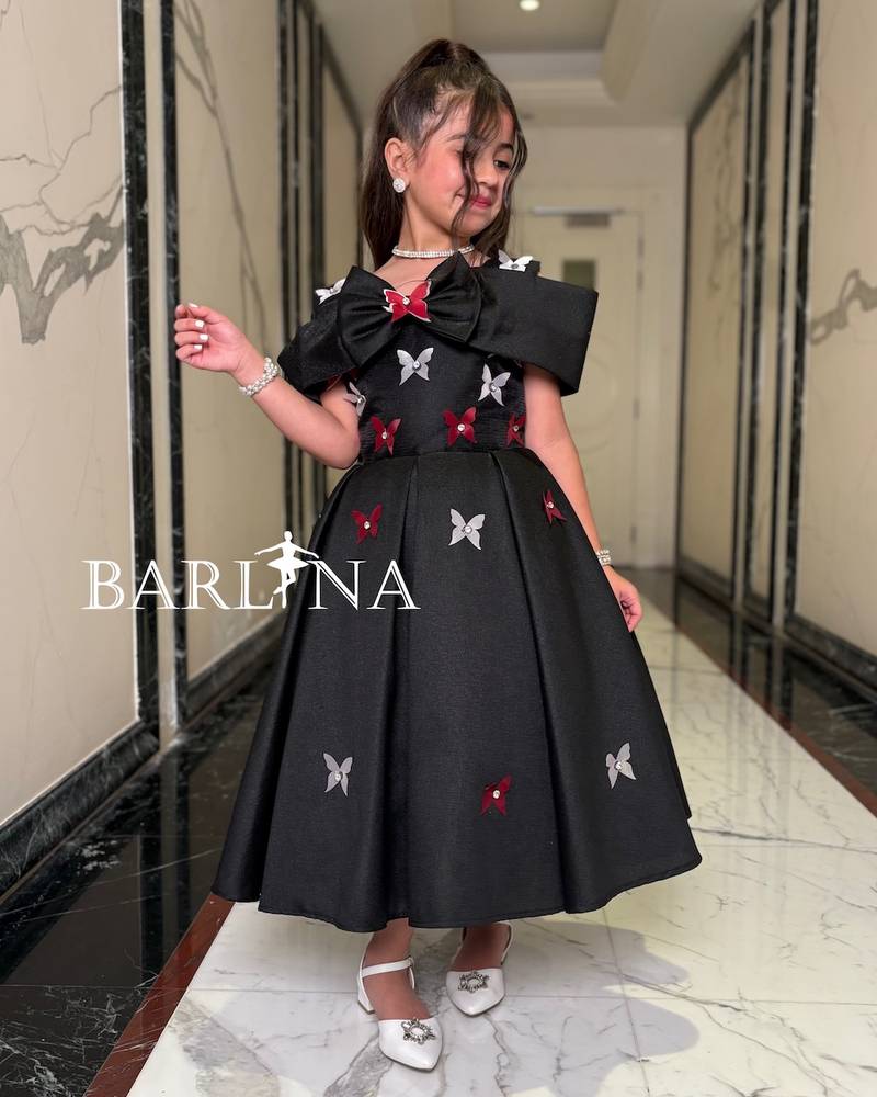 Girls' black off-shoulder dress with butterflies