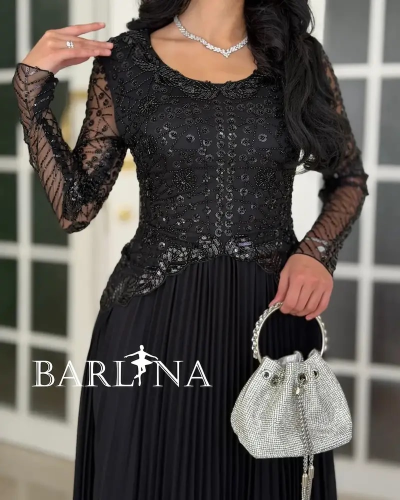 Luxurious black dress with embroidery on the top