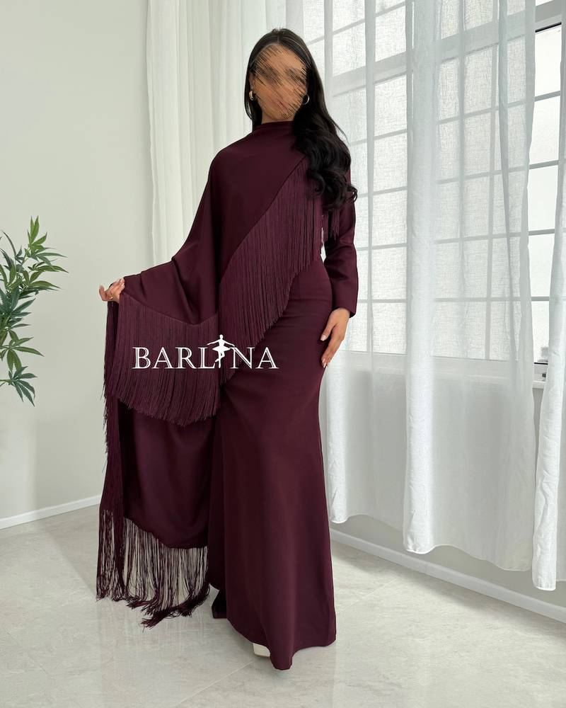 Elegant burgundy dress with a side shawl and tassels