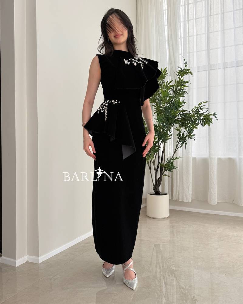 Black velvet dress with embroidered side details