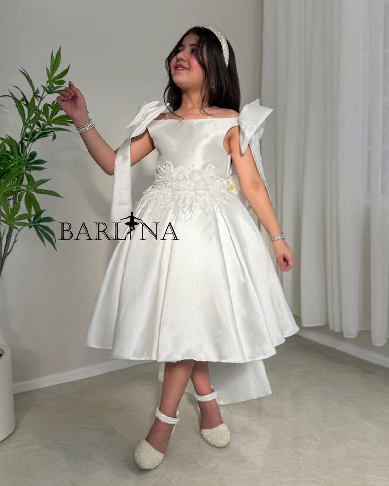 White girl's dress with delicate floral details