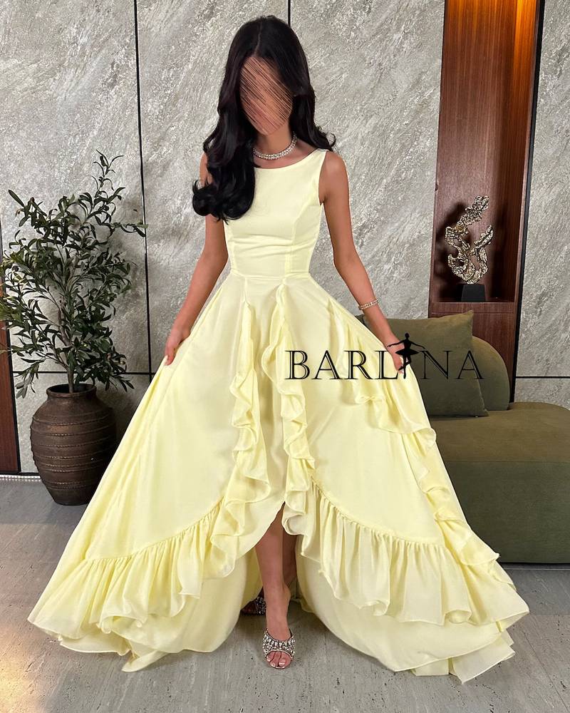 Lemon yellow dress with a slit and ruffle detail