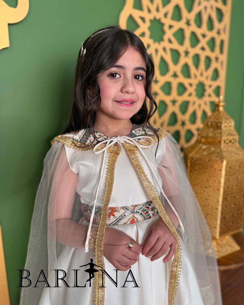 Off-white girls' dress decorated with oriental embroidery