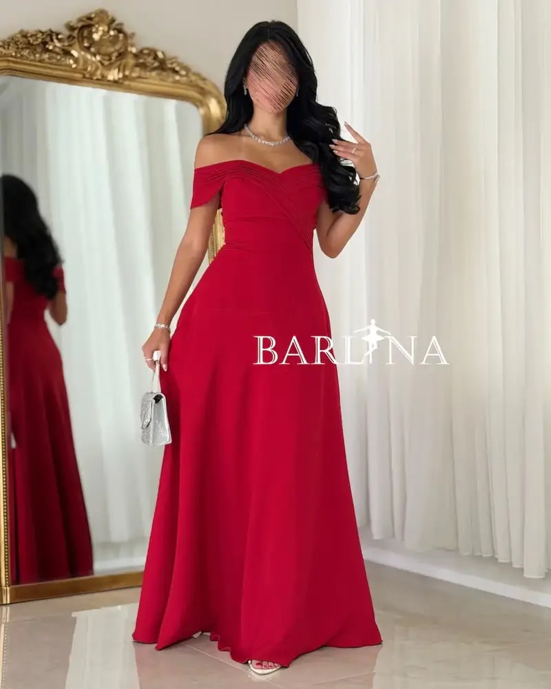 Long red dress with a flowing off-the-shoulder design