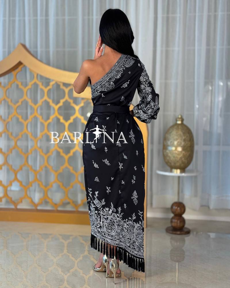A black dress with elegant silver patterns