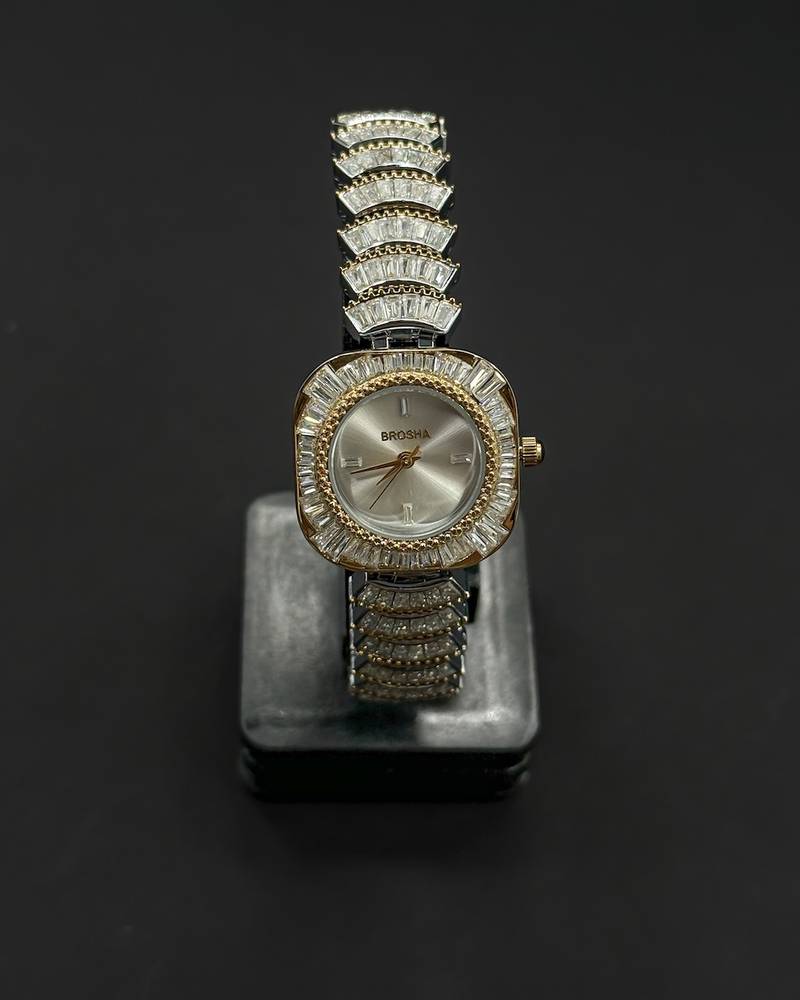 watch with a rounded square frame adorned with crystals