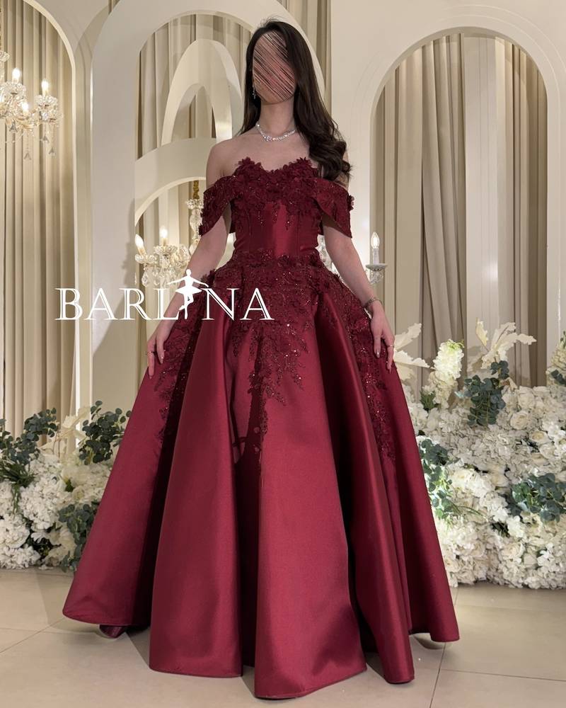 Off-shoulder burgundy dress with prominent embroidery