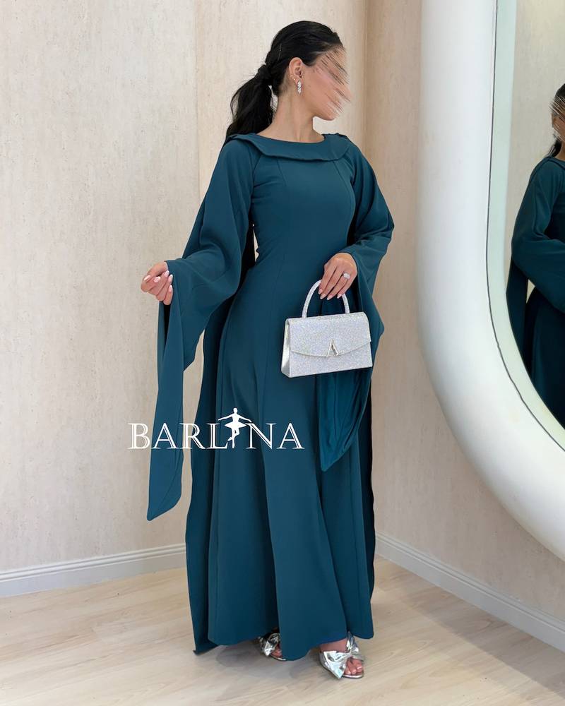 Petrol blue dress with a wide design and loose sleeves