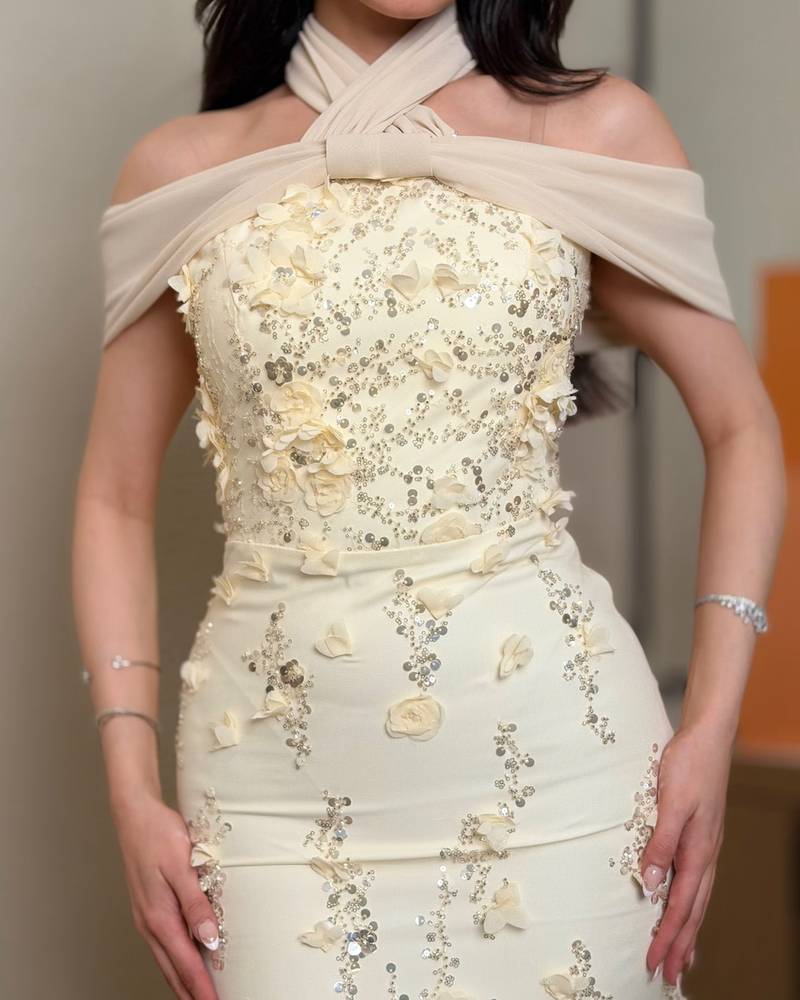 Ivory evening dress with a wrap halter neckline
