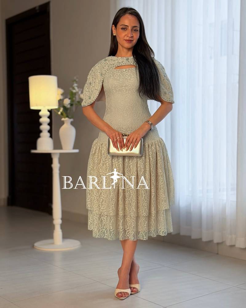 Beige lace dress adorned with pearls