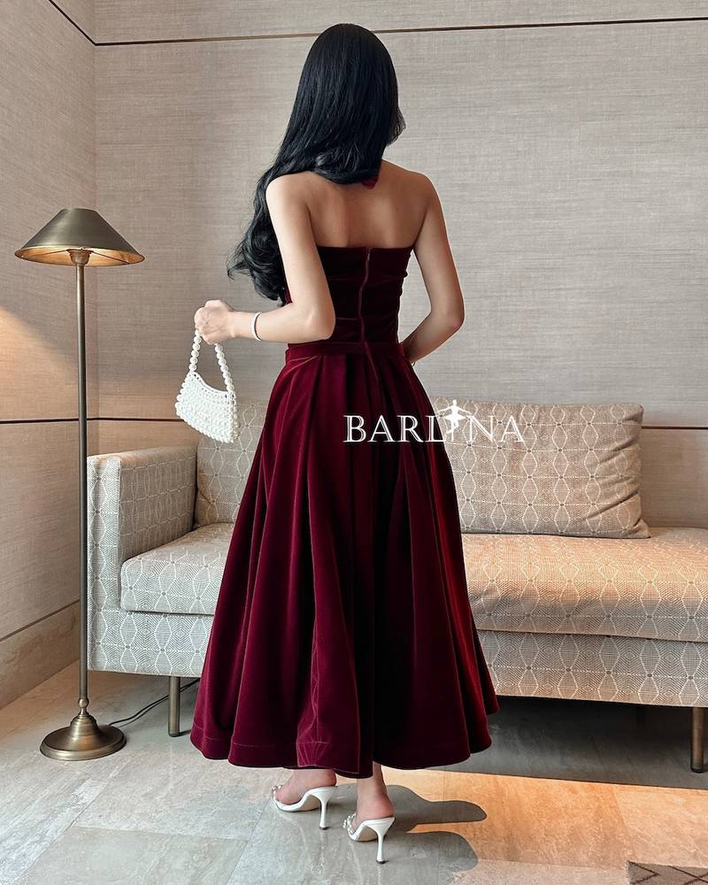Soft burgundy velvet dress with a tie around the neck
