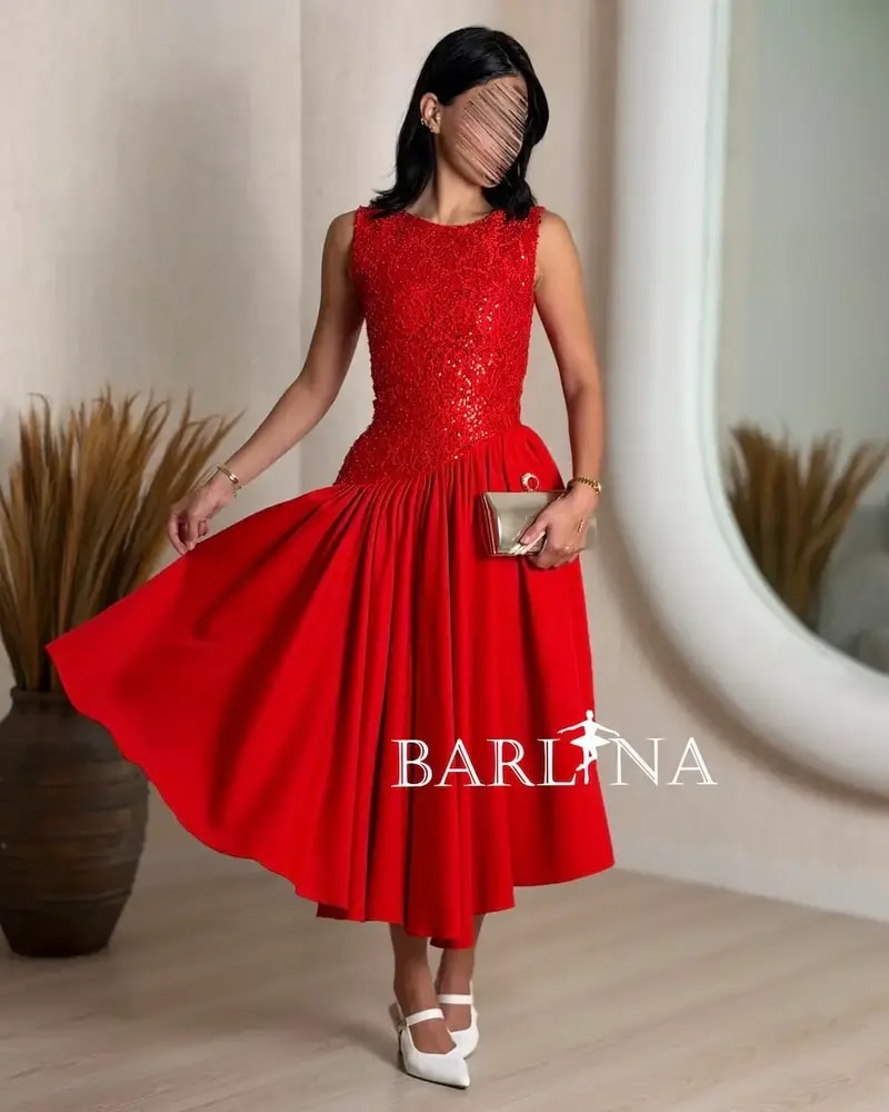 Soft midi dress with a sequined bodice