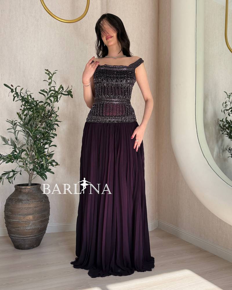 Elegant purple dress with heavy embroidery on the top