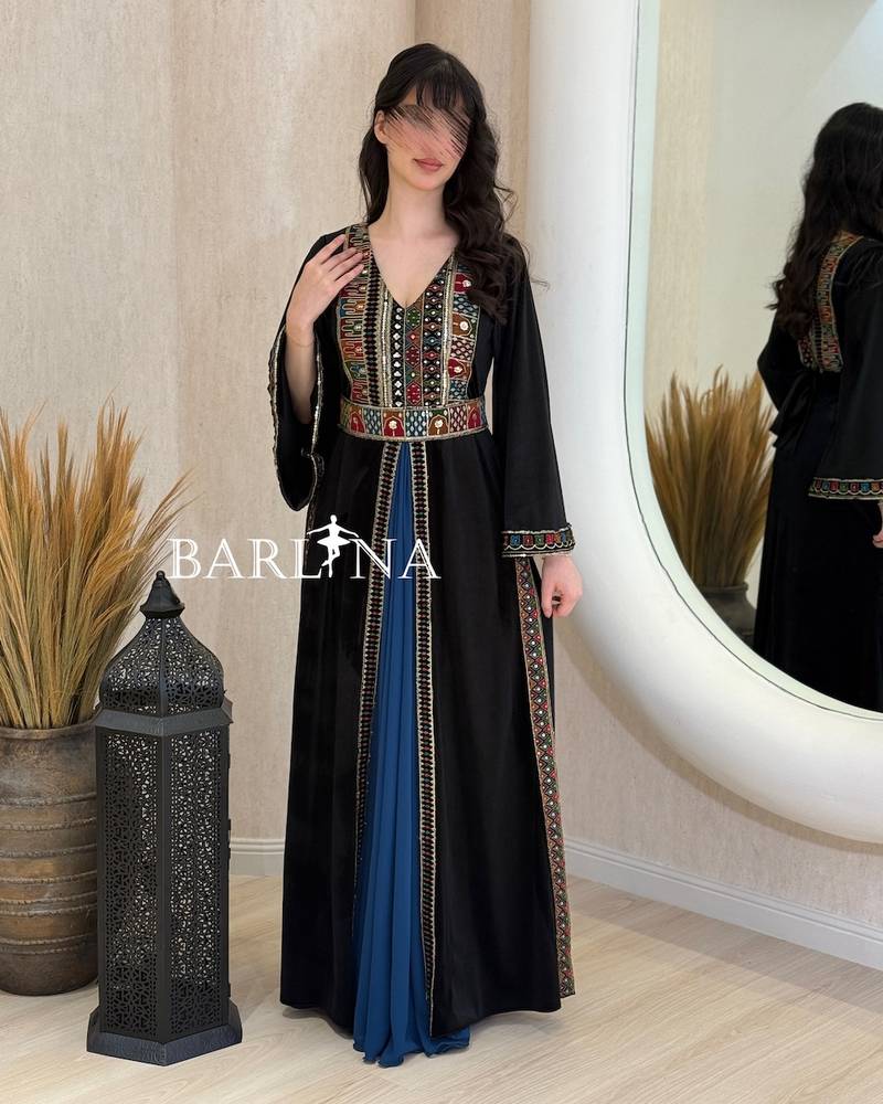 Black jalabiya embroidered with colorful patterns