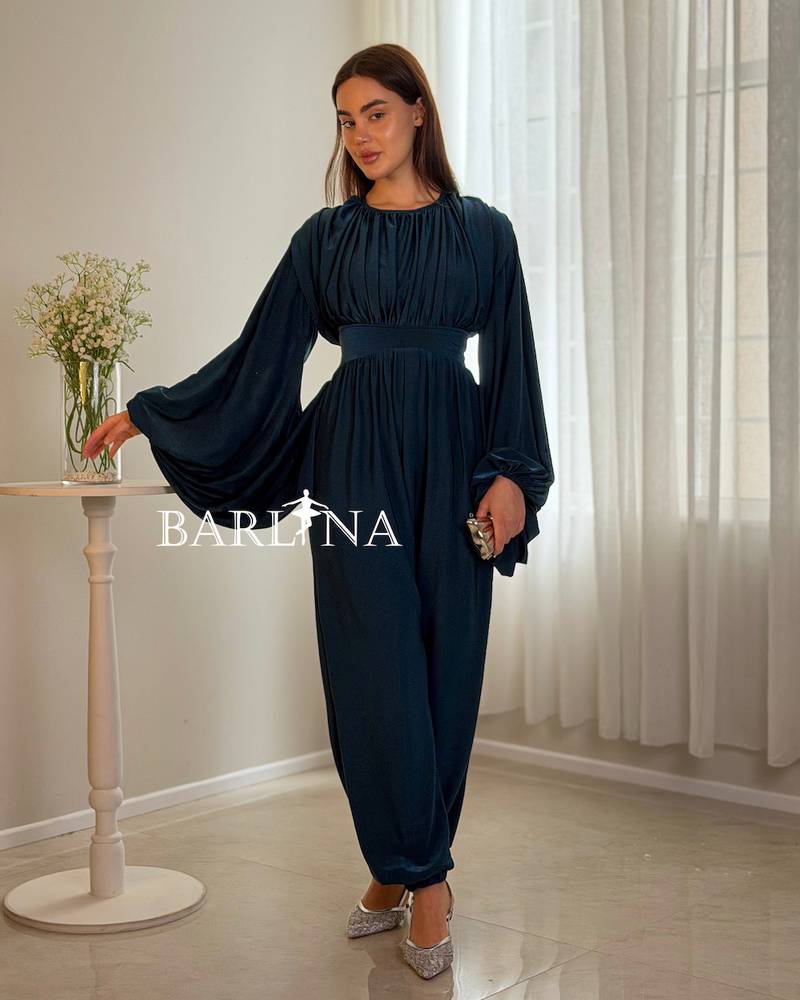Navy jumpsuit with wide sleeves and a defined waist
