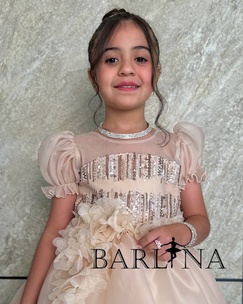 Girls' beige dress with flowing prominent flowers