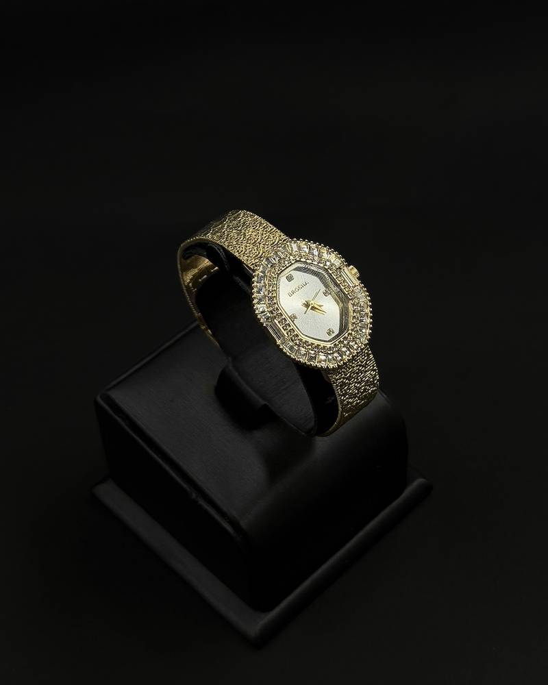 Womens watch with an oval bezel fully studded