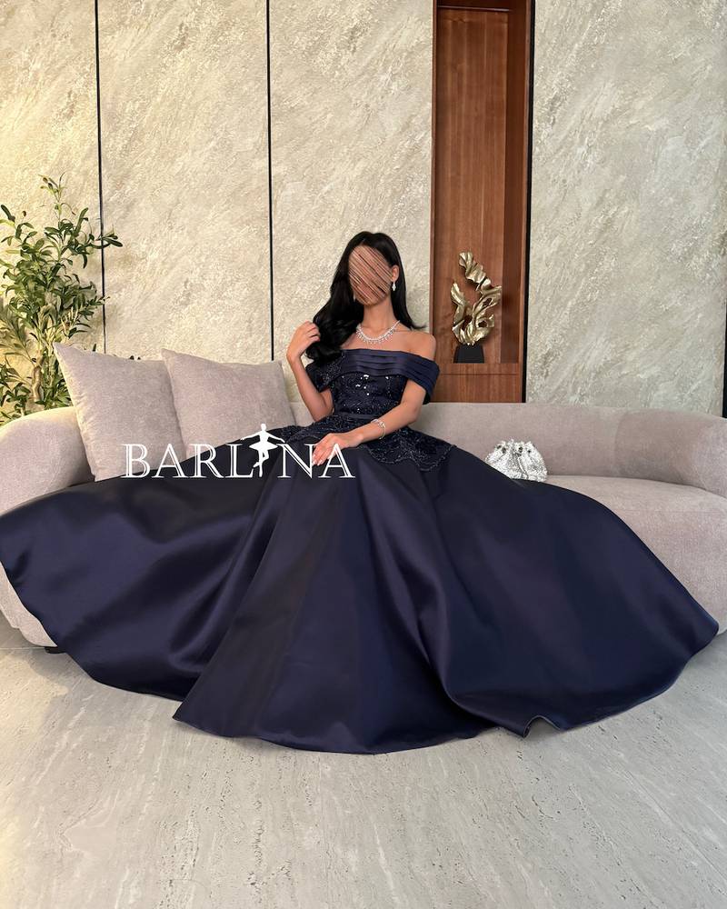 Navy blue evening dress with luxurious embroidery on the chest