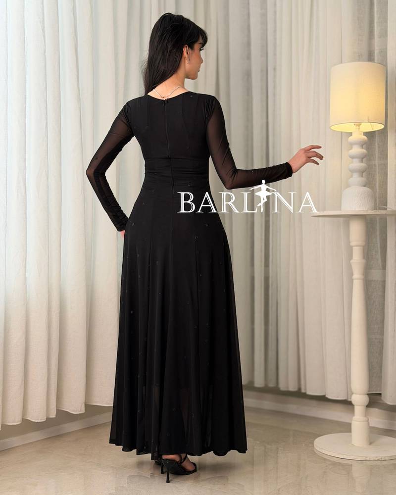 A long, elegant, sophisticated, and feminine black dress