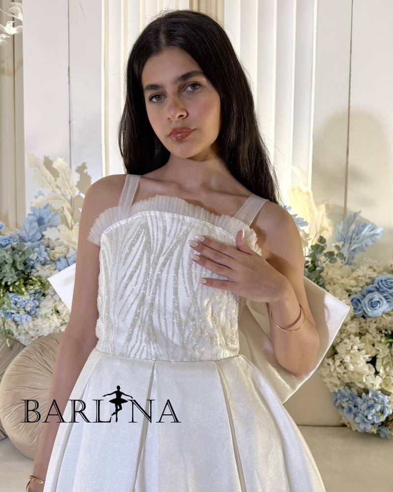 White evening dress with long bow tail