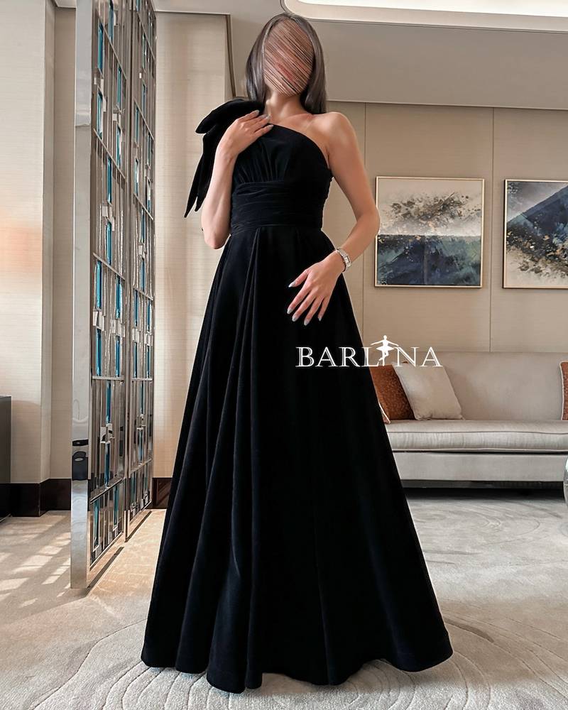 Black velvet dress with bow on the shoulder