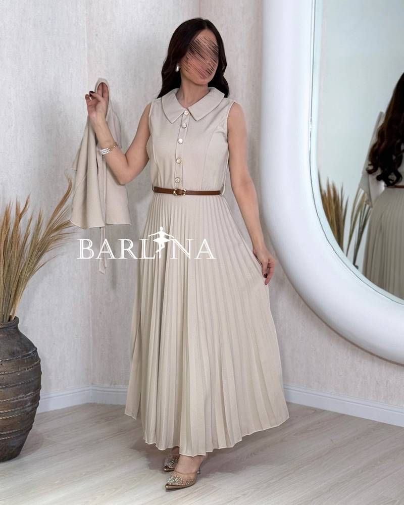 Beige pleated dress with a short flowing cape