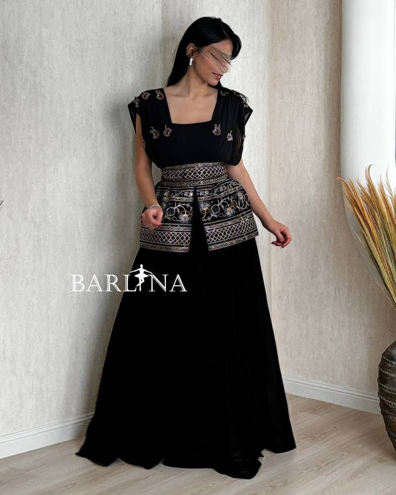 Long black jalabiya with elegant, harmonious embroidery